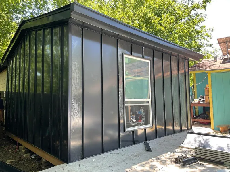Black standing seam metal wall panels for Roof Inspection in Forest Park